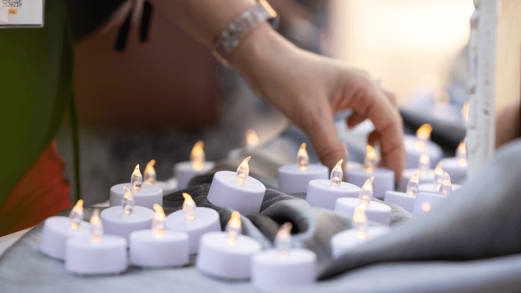 Participants of GCSRW's Service of Lament, Confession, and Hope lit flameless candles in honor of victims and survivors of sexual misconduct within The United Methodist Church. Photo courtesy of Joscelyne Cutchens, 2024.