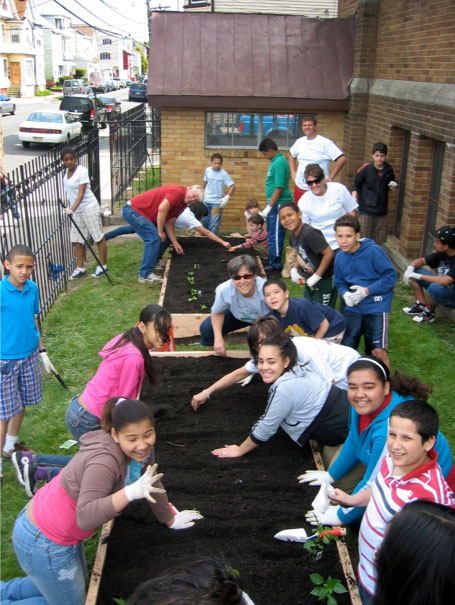 Volunteers work in a community garden. Photo courtesy Connectional Table. Volunteers work in a community garden. Photo courtesy Connectional Table.