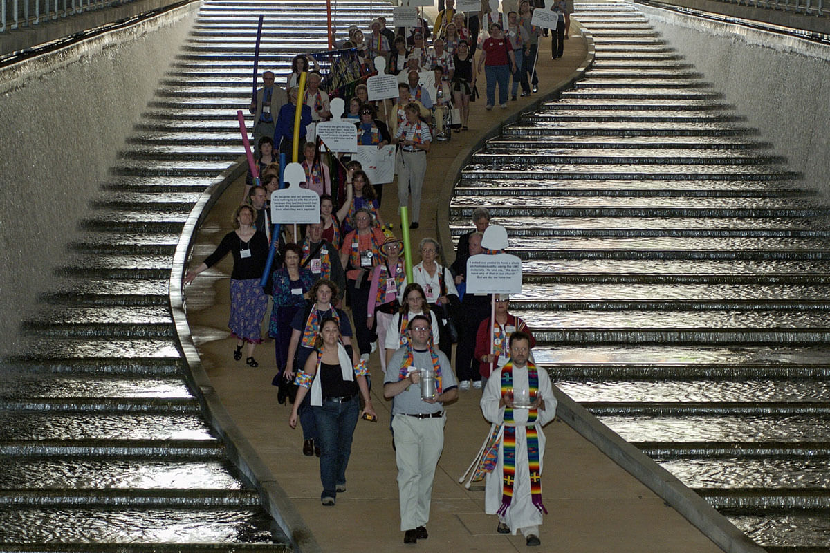 Members of Methodist Students for an All-Inclusive Church (MOSAIC) march to the Allegheny River through the David L. Lawrence Convention Centerin Pittsburgh, site of the 2004 United Methodist General Conference. The group is pushing the denomination to fully accept gays and lesbians in its churches and pulpits. At the end of the march it held a service of renewing the baptismal covenant on the banks of the Allegheny River. A UMNS photo by Paul Jeffrey. Photo number GC04324, 5/01/04 Members of Methodist Students for an All-Inclusive Church (MOSAIC) march to the Allegheny River through the David L. Lawrence Convention Centerin Pittsburgh, site of the 2004 United Methodist General Conference. The group is pushing the denomination to fully accept gays and lesbians in its churches and pulpits. At the end of the march it held a service of renewing the baptismal covenant on the banks of the Allegheny River. A UMNS photo by Paul Jeffrey. Photo number GC04324, 5/01/04