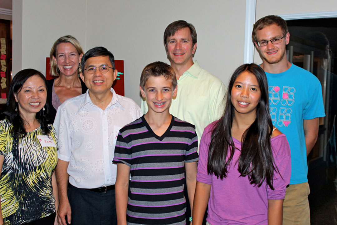 The Work family hosts missionary pastors Ut To and Karen Vo To in Michigan. Pictured: Karen, Julie, Ut, Byron, George, Grace, Charlie. PHOTO: COURTESY JULIE WORK