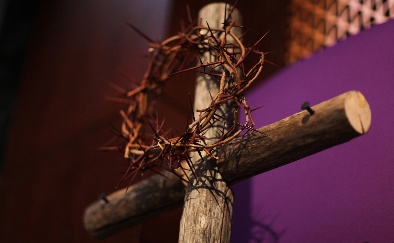 Display featuring a crown of thorns and cross with purple cloth heralds the beginning of Lent. File photo by Kathleen Barry, United Methodist Communications.