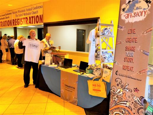 Photo by Fran Walsh  Joe Masterson, lay leader, checks out the United Methodist Communications booth at the Wisconsin Annual Conference.
