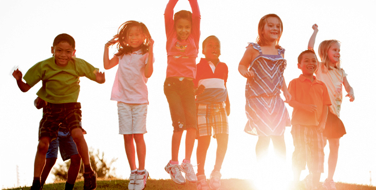 Children playing with sunset in background. Image courtesy of Discipleship Ministries. 