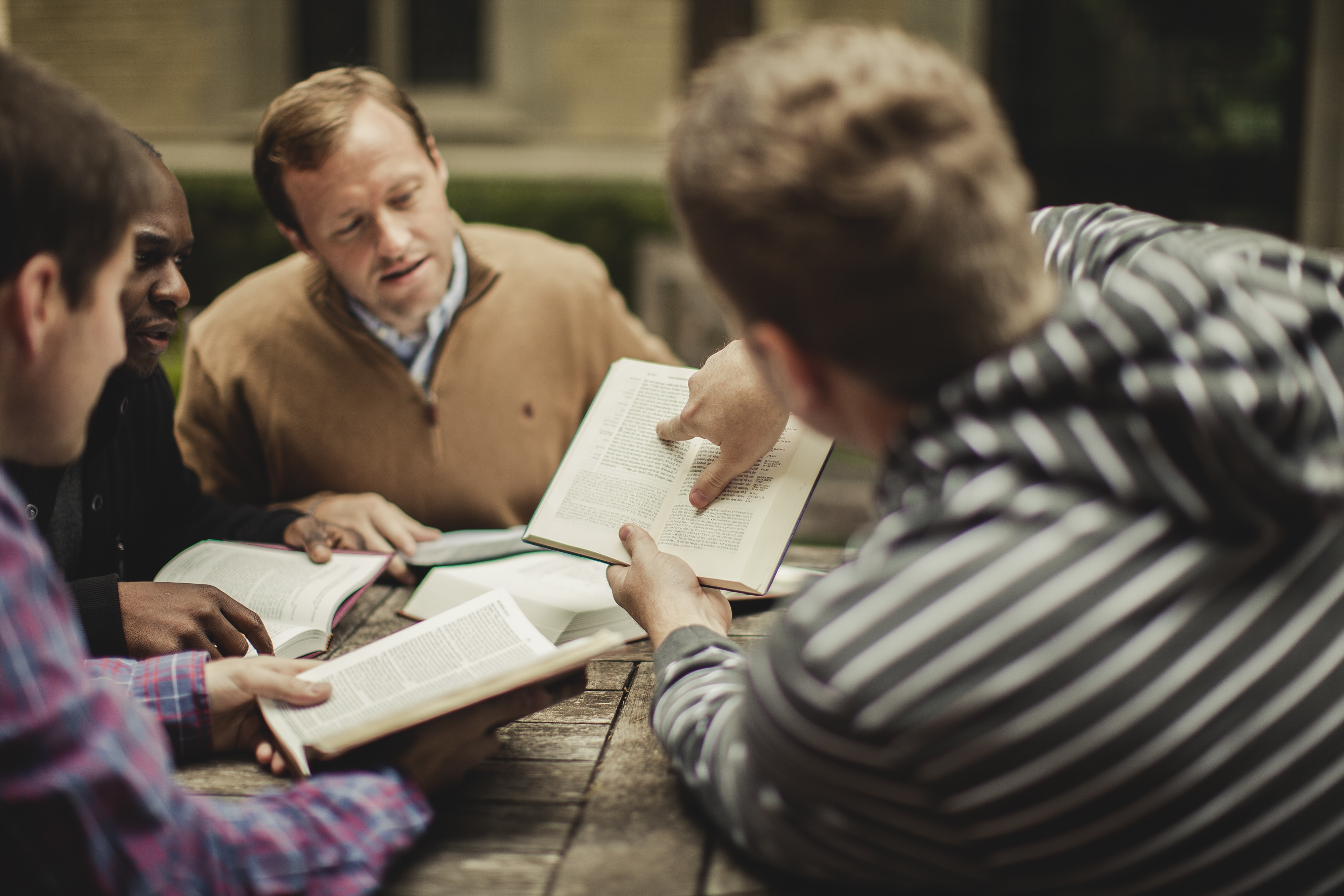 A small group of men study the Bible. Photo by Shaun Menary, Lightstock.com.