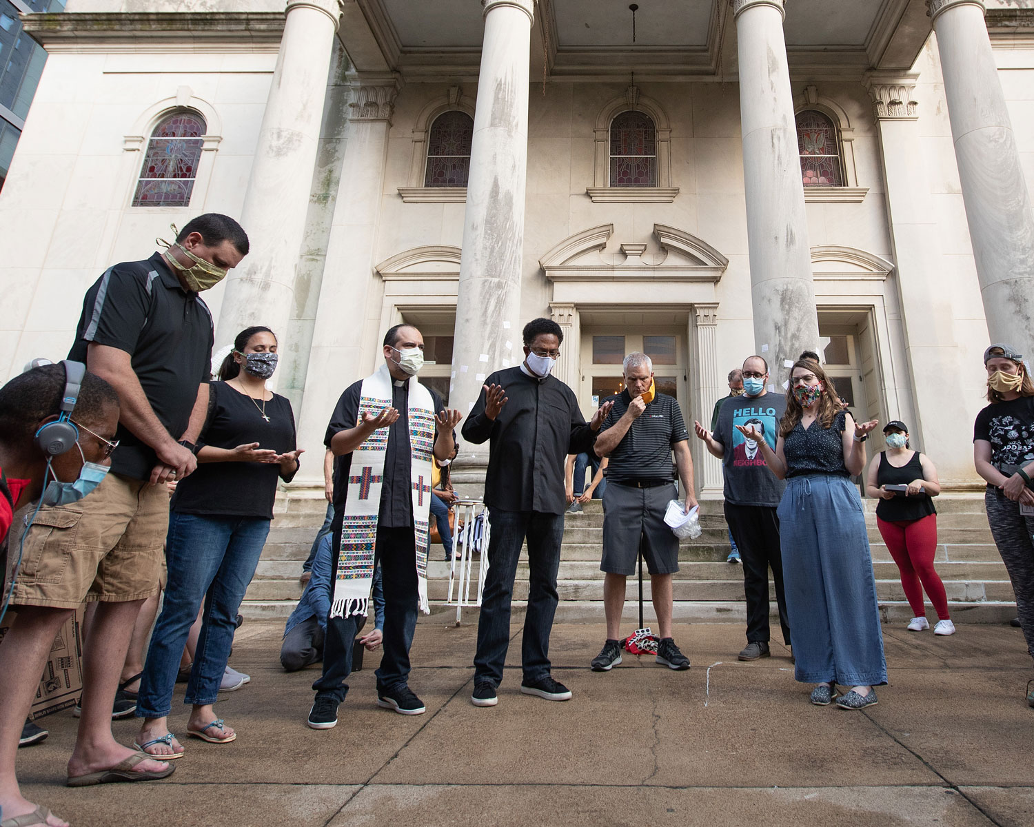 Clergy members gather in prayer during a vigil at McKendree United Methodist Church in Nashville, Tenn., to grieve and remember people lost to acts of racism. Photo by Mike DuBose, UM News.