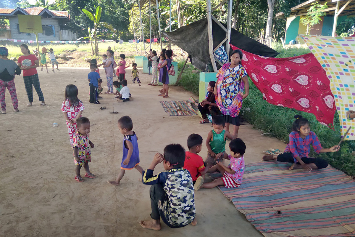 Women and children, many of them United Methodists, take shelter under the covered court of a local elementary school in the Arakan barangay of North Cotabato, Philippines. They fled their homes amid insecurity in the region. The families evacuated without clothes or other necessities, and The United Methodist Church in the Philippines is offering assistance. Photo courtesy of the Rev. Recto Baguio.