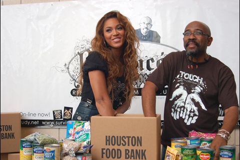 The Rev. Rudy Rasmus, senior pastor at St. John’s Downtown Church in Houston and editor of the book “I’m Black. I’m Christian. I’m Methodist,” attends a food bank event with the singer Beyoncé, who grew up in that church. Photo courtesy of St. John’s Downtown Church in Houston.