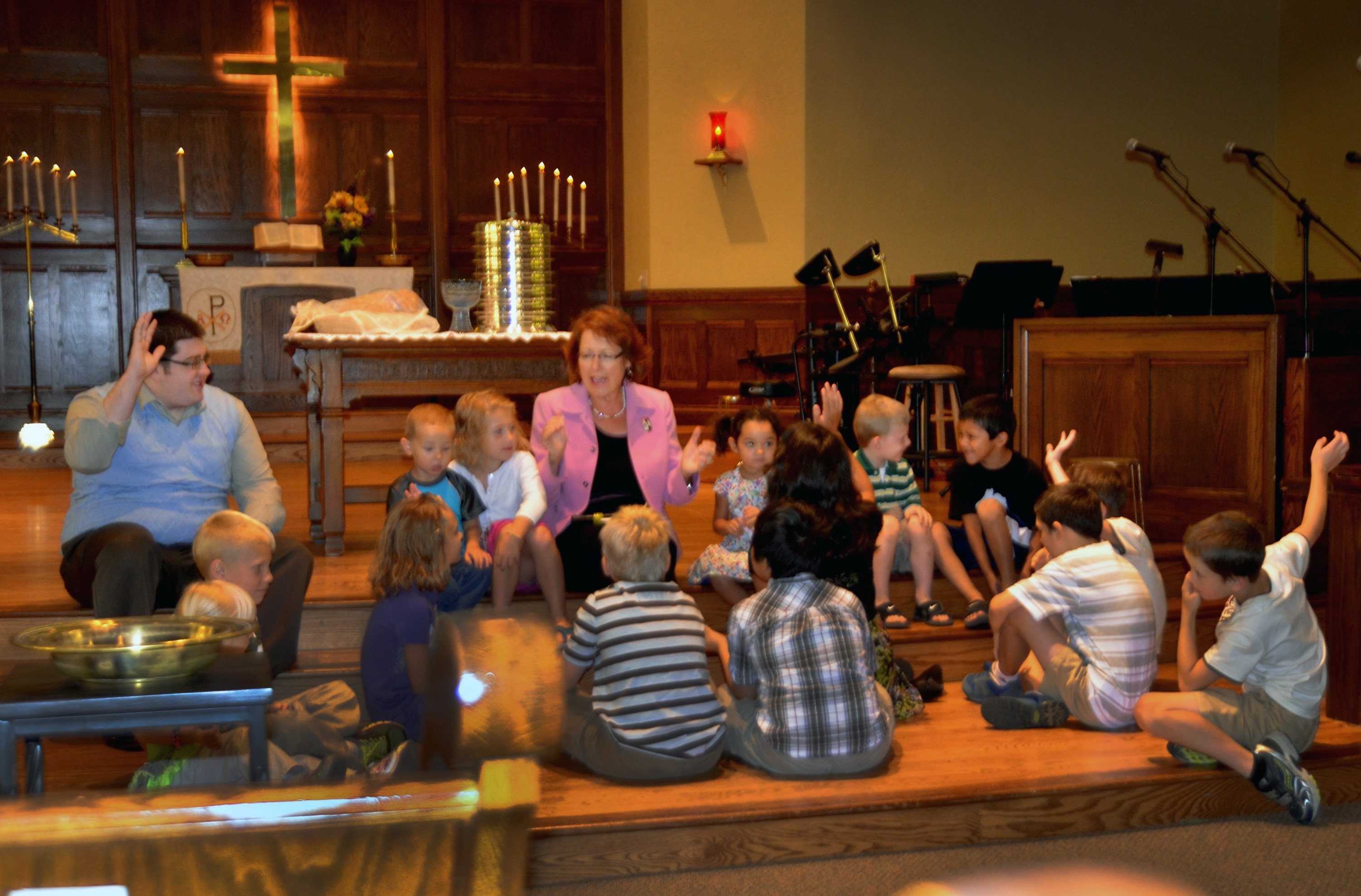 The Rev. Kathy Hartgraves instructs the children during the Aug. 4 worship at First United Methodist Church in Mitchell, S.D. Photo courtesy of the Dakotas Conference. This photo was taken pre-COVID.