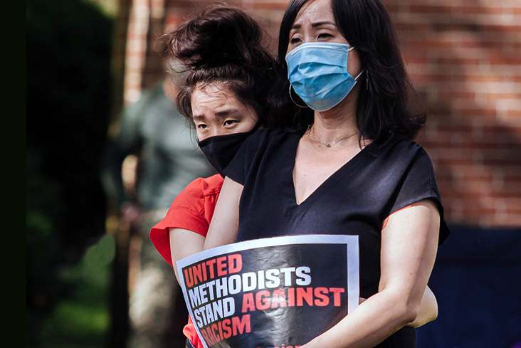A woman holds a sign saying, “United Methodists stand against racism,” during a Black Lives Matter rally in Willingboro, New Jersey, June 7 at St. Paul United Methodist Church. Photo by Aaron Wilson Watson.