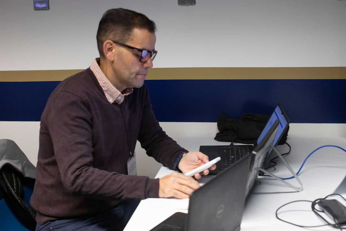 Gustavo Vasquez, director of Hispanic/Latino News, is shown working on UM News coverage. (Photo by Kathleen Barry for UM News.)