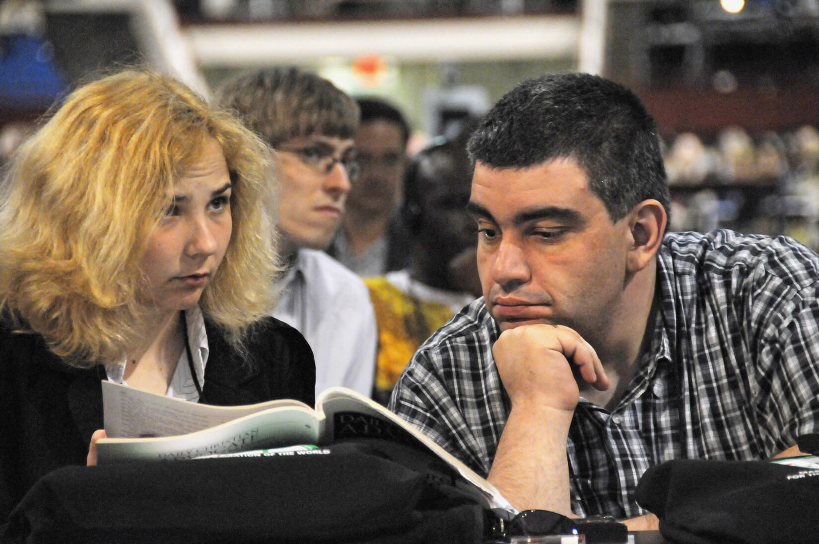 Violetka Zheceva and Samuel Altunian of Bulgaria examine the Daily Christian Advocate during the April 23 organizational session of the 2008 United Methodist General Conference in Fort Worth, Texas. A UMNS photo by John C. Goodwin.