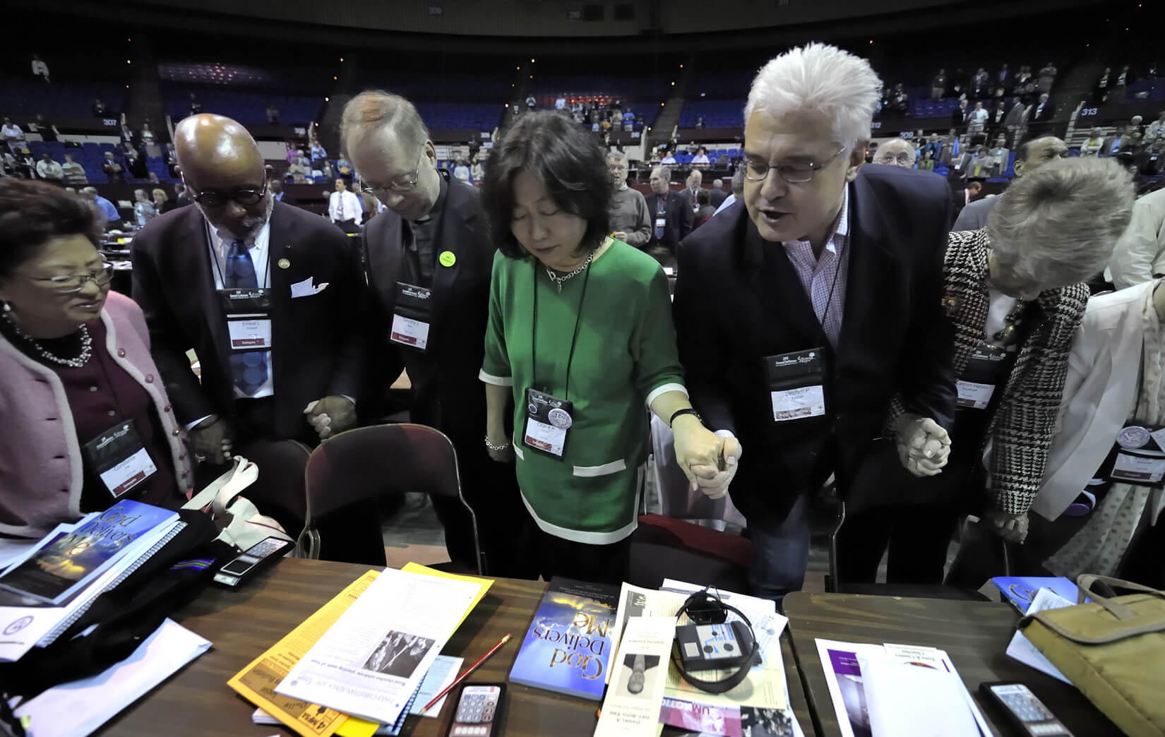 Members of the New York Annual (regional) Conference pray together before the beginning of the April 27 session of the 2008 United Methodist General Conference in Fort Worth, Texas. A UMNS photo by Paul Jeffrey.