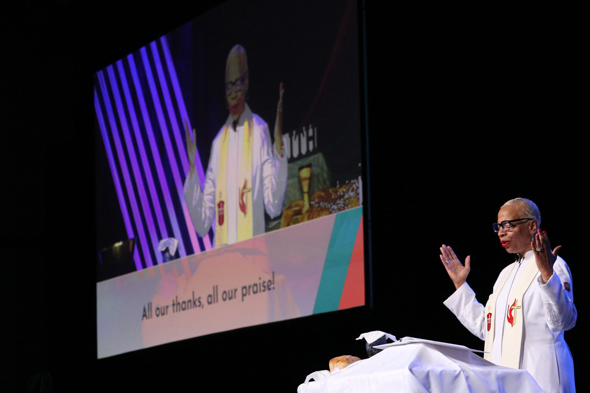 Bishop Tracy S. Malone blesses the communion elements during a service at the East Ohio Annual Conference on June 8. Malone is the convener of the joint task force that brought together members of the Standing Committee on Central Conference Matters, the Connectional Table and developers of the Christmas Covenant to refine proposed legislation that would put the different geographical regions of the global church on more even footing. File photo courtesy of East Ohio Conference Communications.  