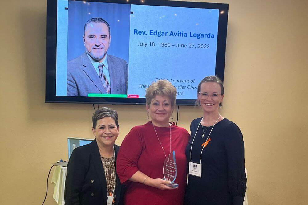 Pictured (l-r): Bishop Cynthia Fierro Harvey, GCAH president; Giuseppina Lauretano Avitia, who accepted the award on behalf of her husband, Rev. Edgar Avitia Legarda; Dr. Ashley Boggan D., GCAH general secretary. Photo by Crystal Caviness. 