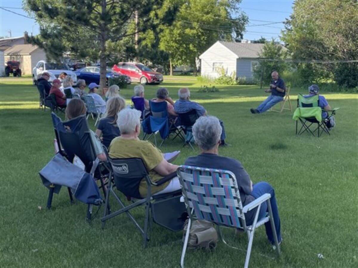 Every Thursday night all summer long, community members gather outside of the Clarissa UMC parsonage for “Porch Ponderings” with speakers sharing their perspectives on a variety of important topics. Photo courtesy of the Minnesota Annual Conference.