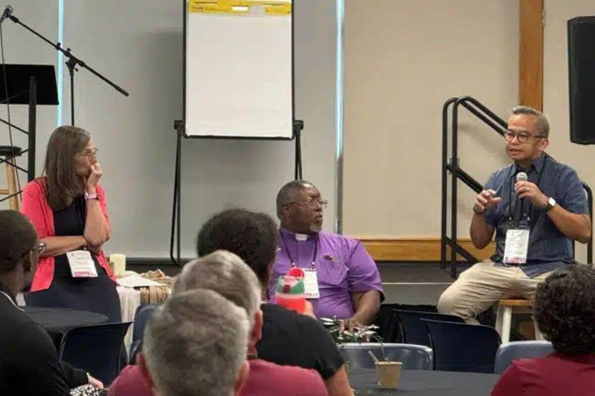 Bishop Sandra Steiner Ball, Bishop Frank Beard, and Bishop Carlo Rapanut are answering questions as part of a panel discussion for new district superintendents. Photo by April Casperson